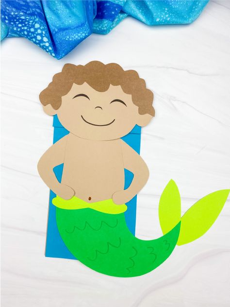 This boy mermaid puppet is a fun ocean themed craft for boys to make! Download the free printable template and create it this summer. Mermaid Puppet, Mermaid Boy, Ocean Theme Crafts, Snail And The Whale, Male Mermaid, Paper Bag Crafts, Headband Crafts, Mermaid Crafts, Activities For Boys