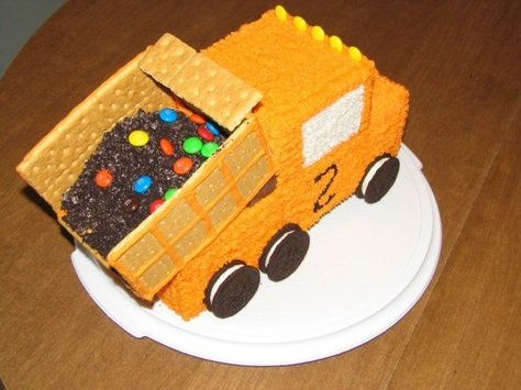 All buttercream.  I used a bread pan for the truck body, and cab.  Graham crackers for the bed, along with crushed Oreos for dirt, and M's.  A Snickers bar is underneath the bed to tilt it up. Truck Birthday Cakes For Boys, Truck Cake Design, Dump Truck Birthday Cake, Dump Truck Cake, Dump Truck Cakes, Truck Birthday Cakes, Owl Cakes, Construction Cake, Truck Cake