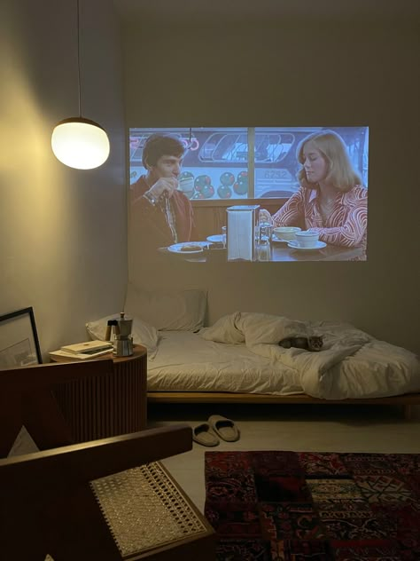 Projector Studio Apartment, Projector In Bedroom Aesthetic, Projector Aesthetic, Cozy Home Theater, Above Bed Shelf, Projector In Bedroom, Nyc Studio Apartments, Mini Projector, Bed Shelves