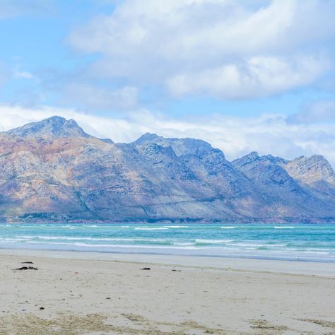 Strand Beach is on the coast of Somerset West, Cape Town. It's a lovely long, flat, sandy beach that looks onto the Heldeberg Mountains. #landscape #seascape #coastal #capetown #strand #beach #heldeberg #coast #ocean #sea #southafrica Strand Beach Cape Town, Somerset West, Sea Coast, Mountains Landscape, Magic City, Coastal Landscape, The Coast, Somerset, Cape Town