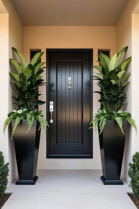 Give your front door a fresh new look with tall planters. From classic to contemporary, explore designs that enhance your home's exterior. Exterior Entryway Ideas Front Entrances, Outdoor Planters Front Door, Exterior Entryway Ideas, Tall Planters Front Door, Brown House Exterior, Front Door Flower Pot Ideas, Planters Front Door, Porch Goals, Potted Plants Indoor