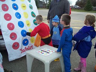 Here was another fun idea. Merritts had a twister game on the back of their van. The kids got to spin the spinner and pick candy from what ever color they ... Church Trunk, Trunker Treat Ideas, Fall Festival Games, Trunk Or Treat Ideas, Fall Carnival, Festival Games, Children Church, Harvest Fest, Halloween Games For Kids