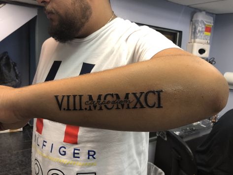 Greek Date Tattoo, Roman Numeral Tattoo Men Arm, Greek Numbers Tattoo, Arm Tattoos For Guys Sleeve, Roman Numeral Tattoo Men Forearm, Date Tattoo Ideas For Men, Text Tattoo Arm, Roman Numeral Tattoo Men, Roman Numeral Tattoo With Name