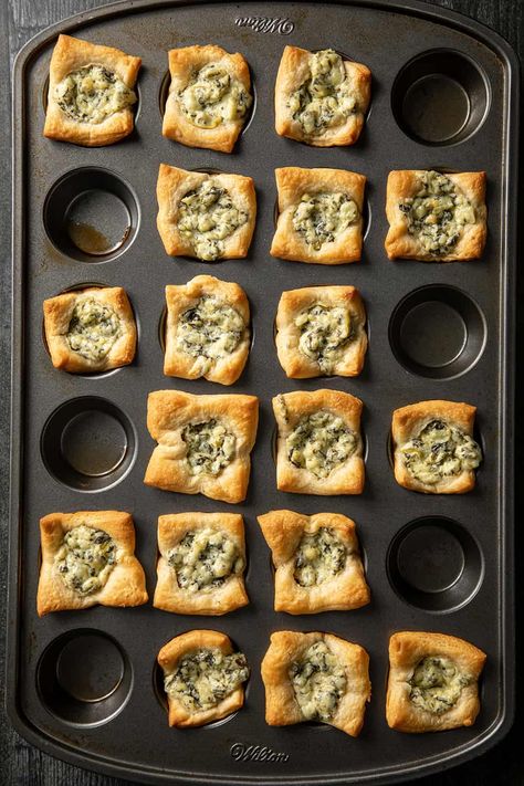 Spinach Artichoke Bites use just two ingredients to make an incredibly easy appetizer! These bites are perfect for a holiday party or even adding to a game-day spread. Crescent Dough Sheet Recipes, Crescent Roll Recipes Appetizers, Spinach Artichoke Recipes, Crescent Sausage Bites, Spinach Artichoke Bites, Artichoke Bites, Artichoke Appetizer, Spinach Bites, Crescent Roll Appetizers