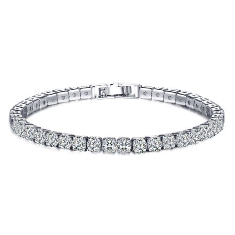 Looking for some extra arm candy? Our Brilliant Eve tennis bracelet features clear .25CT. Eq. round CZ stones that don't stop sparkling! It dresses up any outfit and its modest size can even be worn for an everyday look. Measurements: Bracelet Length: 16.5mmClasp: 25mm Hip Hop Fashion Women's, Hip Hop Mode, Mens Chain Bracelet, Bracelet Tennis, Cubic Zirconia Bracelet, Gold Girl, Hip Hop Jewelry, Metal Bracelets, Wedding Bracelet