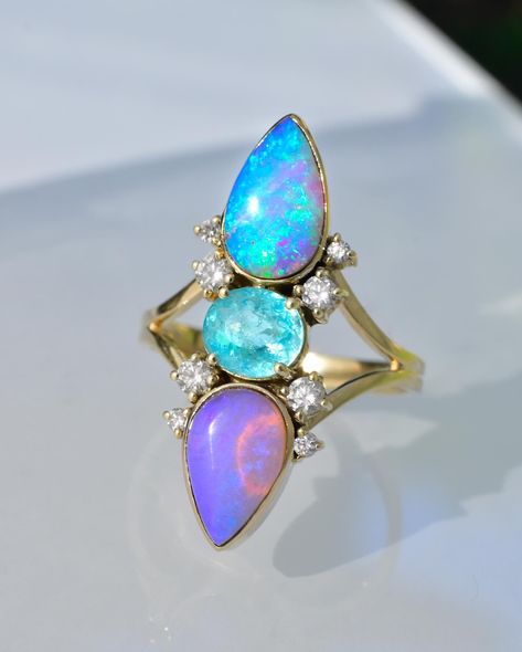 A hand full of beautiful opal rings (and turquoise) which is your favorite of this collection in the making so far? The new Turquoise Statement Ring one in the second slide is a rare light robins egg Shade of White Buffalo Turquoise which is usually white, Paired with minty, tourmaline, and diamonds and yellow gold! 1) group photo of Angel alchemy talisman rings featuring rare shades and qualities of hard to find gemstones, from a collection which I have meticulously curated for over a deca... My Dreams Come True, Turquoise Statement Ring, Australian Opal Ring, Trinity Ring, White Buffalo Turquoise, Paraiba Tourmaline, Robins Egg, Group Photo, Robins Egg Blue