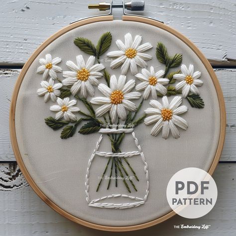 DESCRIPTION Add a touch of whimsy to your embroidery projects with this charming Vase of White Daisies hand embroidery pattern! Perfect for flower lovers and embroidery enthusiasts. Get your hoop ready and let's stitch up some floral magic with this delightful embroidery project! Happy stitching! This listing is for a digital PDF pattern, which includes: ~ Printable pattern scaled to fit 3" to 8" hoops ~ Beginner's Guide to Hand Embroidery ~ Reference photo of completed embroidery for inspiratio Flower Designs Embroidery, Back Stitch Motif, Embroidery Daisy Patterns, Embroidery White Flowers, White Flowers Embroidery, Hand Embroidery Flowers Pattern, Floral Embroidery Patterns Free, Beginner Embroidery Projects, Flower Stitch Embroidery