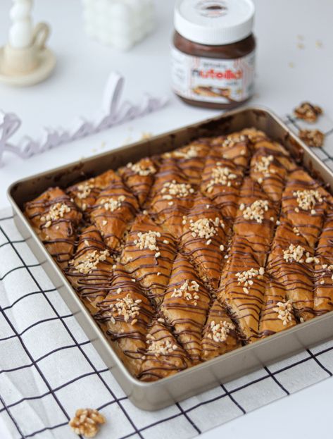 Let me introduce a new Ramadan favorite recipe. This delicious Ferrero Baklava has a crunchy buttered filo pastry layered between... Viral Ticktock Recipes, Biscoff Baklava, Chocolate Baklava, Baking Prints, Biscoff Recipes, Filo Pastry, Easy Baking Recipes Desserts, Ramadan Recipes, Chocolate Filling