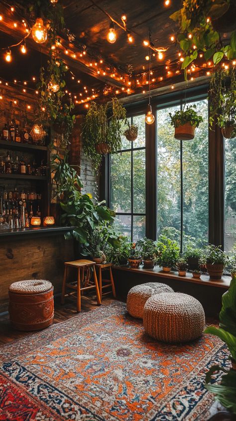 Cozy home bar with warm tones, string lights, boho decor, greenery, and natural lighting for a festive atmosphere. Warm Cozy Interior Design, String Lights In Living Room, Earthy Christmas Decor, Witchy Christmas Decor, Cozy Townhouse, Small Ottomans, Cozy Cabin Aesthetic, Cozy Christmas Cabin, Lights Boho