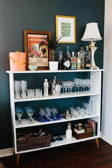 7 genius small kitchen ideas - use a bookshelf if you're lacking cabinet space Bookcase Into Bar, Bookshelf Into Bar, Bar Cart Bookshelf, How To Decorate A Bar, Drinks Shelf Ideas, Cocktail Shelf, Bar Bookshelf, Small Bar Ideas, Bookshelf Bar