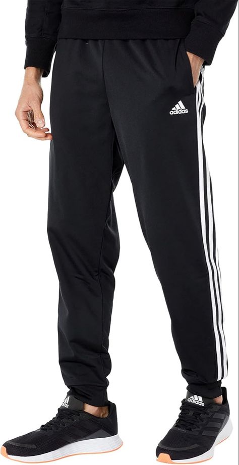 Men's track pants with a tapered cut
Regular tapered fit is not tight and not loose, with a close fit on the legs
Drawcord on elastic waist lets you customize your fit
Front pockets for storage; Cuffed hems for a snug feel
This product is made with Primegreen, a series of high-performance recycled materials White Jogger Pants, Boxer Pants, Amazon Black Friday, Football Pants, Black Jogger Pants, White Joggers, Adidas Track Pants, Adidas Fashion, Tall Clothing