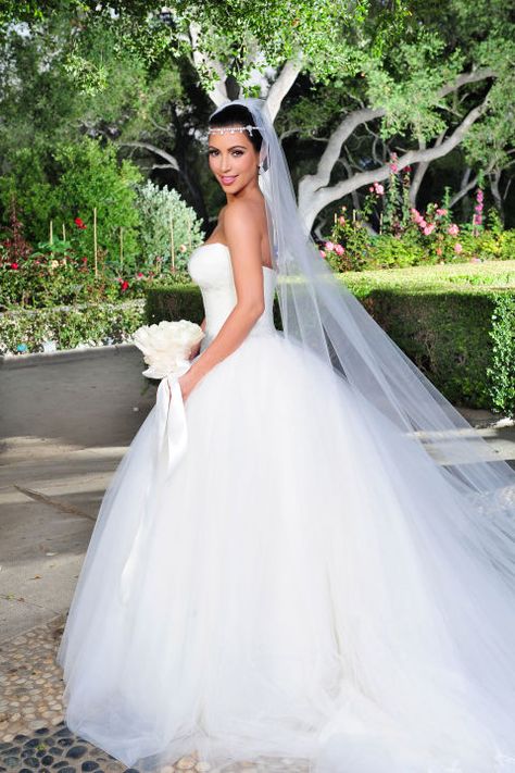 Red carpet looks have nothing on these glamorous gowns.  For Kim Kardashian's second wedding to basketball player Kris Humphries on August 20, 2011, the reality TV star chose not one, but THREE Vera Wang dresses, each costing $25,000. That's a $75,000 total for her wedding day wardrobe. Kim Kardashian Wedding Dress, Most Expensive Wedding Dress, Glamorous Wedding Gowns, Kris Humphries, Vera Wang Wedding Gowns, Kim Kardashian Wedding, Kardashian Wedding, Expensive Wedding Dress, Vera Wang Wedding