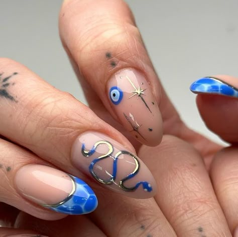 OXFORD GEL NAILS on Instagram: "This colour combo though 🧿🦋🤍  Gel builder on natural nails using:  BLUE GEL POLISHES @glitterbels blue avenue and salty  BUILDER @twenty.pro.official Adele   GOLD CHROME @magpie_beauty Elizabeth  Inspiration from @staceymachin 🫶🏼" Blue And Gold Tip Nails, Blue Nails Gel Design, Blue Nails Ideas Design, Blue Gold Nail Art, Blue Gold Nails Designs, Wicca Nails Designs, Cool Blue Nails, Blue Nail Sets, Blue Acrylic Nails Designs