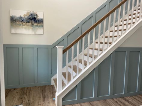 Painted in SW Breezy Blue Stair Panelling, Painted Stair Handrail, Board And Batten Stairway, Sw Breezy, Blue Bannister, Blue Stairwell, Stair Colors, Stair Panelling, Split Foyer Remodel