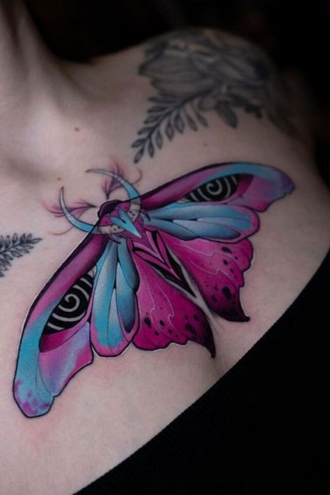 The colorful moth chest ink is a vibrant tattoo idea for women who love bold colors and whimsical designs. This tattoo for female ink enthusiasts adds a splash of color and creativity to any collection. Chest Tattoo Female Color, Colorful Chest Tattoo, Unique Chest Tattoos, Moth Tattoo Color, Tattoo For Female, Tattoo Idea For Women, Front Neck Tattoo, Whimsical Tattoos, Colorful Moths