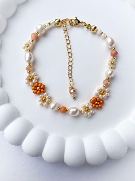 The Autumn beaded bracelet is dainty and elegant. The perfect gift for any woman, friend, sister, daughter, etc. 100% handmade using the best materials.  FEATURES:  * Seed beads sizes 2 to 4mm, freshwater pearls 5-7mm, natural stones 4mm, crystals 4mm. * 18k Gold Plated Lobster clasp and findings. * Made with love and care. LENGHT: Choose between 6.5 or 7 inches + Each bracelet comes with a 1 inch extender chain CARE INSTRUCTIONS: *Remove before exercising taking a shower/bath and sleeping. *Avo Autumn Accessories Jewelry, Autumn Seed Bead Bracelet, Autumn Beaded Bracelet, Autumn Beaded Jewelry, Fall Beaded Jewelry, Fall Beaded Bracelets, Christmas Beaded Jewelry, Fall Jewelry Inspiration, Fall Bracelet Ideas