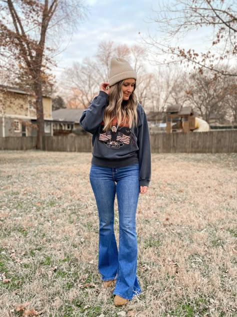 Anine Bing sweatshirt, Aerie beanie, Abercrobie flare jeans and Zara flats. Winter outfit idea. Cold Weather Outfits Bootcut Jeans, Casual Sweatshirt Outfit With Jeans, Flare Jeans And Tshirt Outfit, Sweatshirt And Flare Jeans, Flare Jeans With Sweater Outfit, Flare Jeans And Crewneck Outfit, Flare Jeans And Sweatshirt Outfit, American Eagle Flare Jeans Outfit, Bell Bottom Jeans Outfit Winter Casual