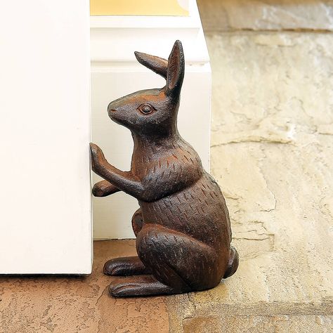 A practical and decorative home accessory, our charming rabbit door stop is crafted from weighted cast iron that's sturdy enough to hold open interior doors.A fantastic housewarming present or a thoughtful 6th anniversary gift that's perfect for a traditional style home interior. The antique brown finish is deliberately distressed for a vintage style look that's right on trend, and boasts plenty of attention to detail to make an eye catching feature piece. Sure to raise a smile and be loved by Fabric Door Stop, Cast Iron Doorstop, Beautiful Rabbit, 6th Anniversary Gifts, Bunny House, Beautiful Greeting Cards, Door Stops, Door Stopper, French Country Style