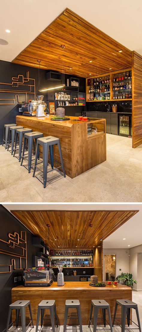 This modern wood bar has everything needed for making high quality coffee and cocktails. Black floating rectangular boxes blend in to the dark accent wall and provide additional storage. Bar Wood Design, Black And Wood Bar, Wood Bar Design, Outdoor Wood Bar, Modern Bar Design, Cafe Bar Interior, Cocktail Bar Design, Wood Bar Top, Bar Countertops