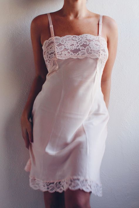 This exquisite nightgown features a sheer lace bust that adds a touch of romance and sophistication, making it an ideal choice for warm, light summer nights. Crafted from high-quality vintage fabric, this pink lace slip is designed to provide both comfort and style. The pale pink hue exudes a soft, feminine allure, while the sheer lace detailing on the bust creates a captivating and delicate look. Whether you're lounging at home or looking for a charming addition to your vintage lingerie collect Coquette Summer, Pink Nightgown, Delicate Lingerie, Lingerie Vintage, Chemise Dress, Vintage Slip Dress, Cute Coquette, Vintage Slip, Rose Pale