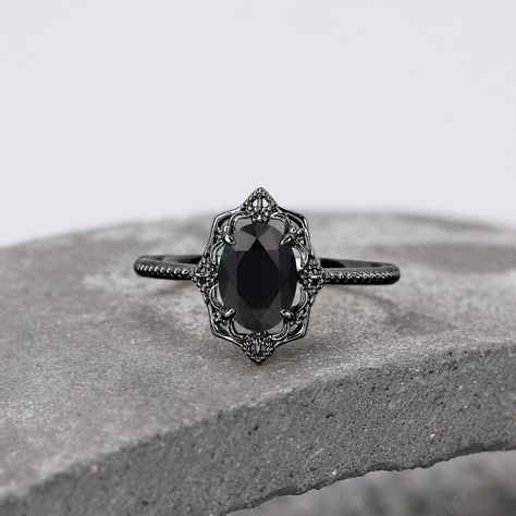 ABOUT THIS RING 18K Black Gold Oval Cut Natural Black Onyx Ring Handmade Engagement Ring For Women Unique Black Gemstone Ring Royal Vintage Style Ring -------------------------------------------------------- 「Product Summary」 ◆ Metal Material: 925 Sterling Silver / Gold ◆ Main Stone Stone: 1.5ct Natural Black Onyx Cut: 6*8mm Emerald Cut ◆ Dimension Band width: 1.7mm ◆ More Information *Can be custom item *Rush orders are accepted *2~3 weeks for order length *14 days money back return policy (exc Black Obsidian Wedding Ring, Black Gemstone Ring, Black Stone Ring, Gold Color Ring, Handmade Engagement Rings, Vintage Style Rings, Black Onyx Ring, Matching Rings, Onyx Ring