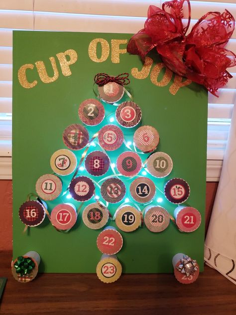 I used a hole punch and pre-printed stickers to cover up the tops and a dab of hot glue to affix it to the board (it peels off the plastic cup easily). I found some poster board lights and gold adhesive letters from Dollar General and had myself an advent calendar! Dollar General, K Cups, Plastic Cup, Hole Punch, Poster Board, Hot Glue, Advent Calendar, Holiday Decor, 10 Things