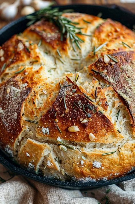 Savor the aroma of this Rustic Garlic Rosemary Skillet Bread, perfectly crusty and infused with fresh herbs. Easy, delicious, and homemade! #BreadBaking #GarlicLovers #RosemaryRecipes #EasyCooking #HomemadeBread Rustic Garlic Rosemary Skillet Bread, Rosemary Skillet Bread, Rustic No Knead Rosemary Garlic Bread, Garlic Rosemary Sourdough Bread, Sourdough Rosemary Garlic Bread, Herb Sourdough Bread, Rosemary Bread Machine Recipe, Rosemary Garlic Bread Recipe, Garlic Rosemary Bread