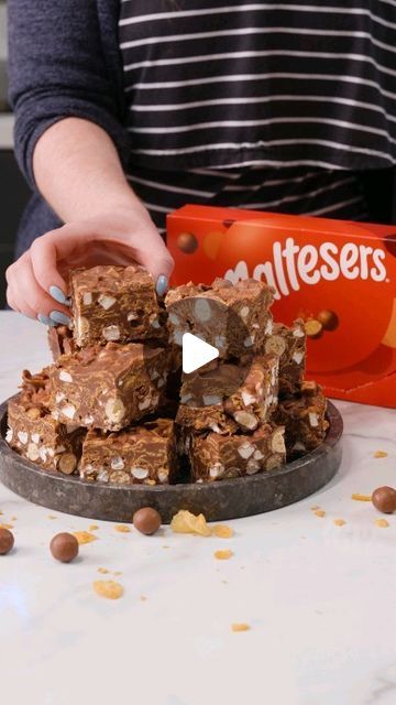 Jane Dunn on Instagram: "Cornflake and Malteser Rocky Road 🤤🍫 Recipe 👇

The easiest no-bake treat for a party or to make with the kids, this rocky road is the perfect twist on the classic!  Super chocolatey, crunchy, marshmallowy and more-ish! YUM!

✨Ingredients✨
■ 500g milk chocolate 
■ 200g golden syrup
■ 200g unsalted butter
■ 125g cornflakes
■ 200g packs of Maltesers
■ 125g mini marshmallows

✨Method✨
■ Add the golden syrup and butter to a pan and melt together 
■ Add the chocolate off the heat and stir until smooth
■ Add the cornflakes, marshmallows, and maltesers to a large bowl and mix
■ Pour in the chocolate mix and stir
■ Pour into a lined 9” square tin and set in the fridge for a couple of hours

Find the full recipe on my blog - www.janespatisserie.com 🥰 
#JanesPatisserie #R Malteser Rocky Road, Rocky Road Recipe, Janes Patisserie, Chocolate Mix, Rocky Road, Slices Recipes, Golden Syrup, No Bake Treats, Cupcake Cookies