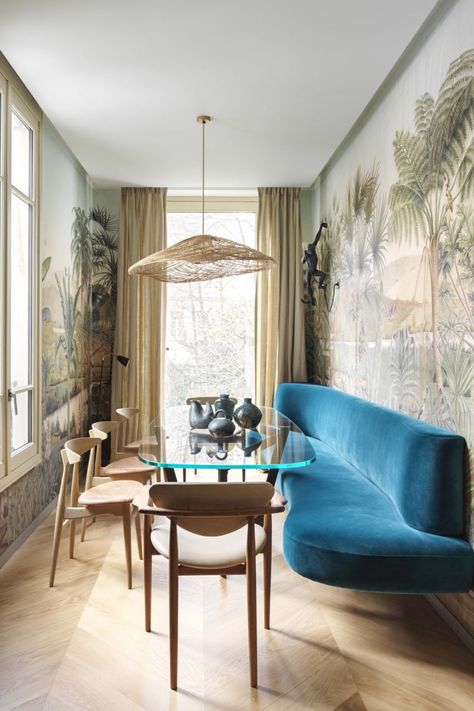 DESIGN | ... The Floating Banquette — In the slender dining room of this Paris apartment designed by Raphaël Le Berre and Thomas Vevaud, an electric blue velvet banquette (Pierre Frey) floats on a wall covered in a panoramic wallpaper inspired by the Napoleonic campaigns in Egypt (Besson). Enameled porcelain monkey sconce, Seletti./ interior design, seating, dining room, bench, furniture, lxury home, interiors /// #dining #interiors #banquette Built In Kitchen Bench, Paris Loft, Banquette Ideas, Dining Room Layout, Banquette Seating, Kitchen Benches, Parisian Apartment, Dining Nook, Home Interiors