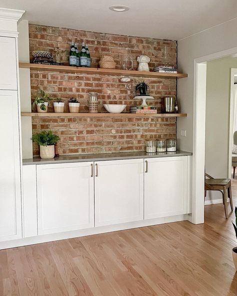 Brick Backsplash Open Shelving, Brick Wall Pantry, Kitchens With Exposed Brick, Floating Shelves On Brick Wall Kitchen, Brick Wall With Shelves, Brick Accent Wall In Kitchen, Brick Backsplash Bar, Shelving On Brick Wall, Brick Accents In Home