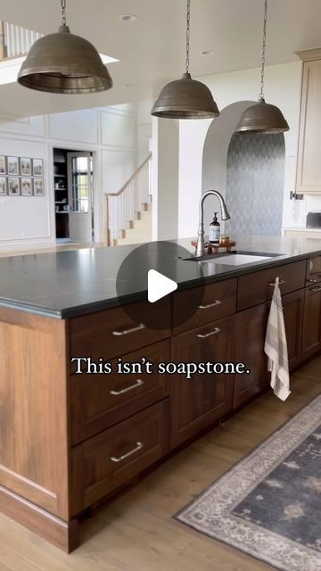 Andrea Nelson | Home Decor | Interior Decorating on Instagram: "The CONTROVERSY with soapstone. 👀  **I’ll tell you EXACTLY what we chose to mimic the look of soapstone while avoiding all the problems that come with soapstone.**  When we were building our home, I knew I wanted a dark countertop paired with dark wood for our kitchen island, with lighter perimeter cabinets and countertops.  HERE’S THE THING… ___________________________  My heart was 100% set on beautiful soapstone.   But as I researched, saw photos online, read horror stories, and saw images of chipped, scratched, dented, discolored soapstone… my heart sank. I appreciate patina… but this seemed to go beyond that.  Surely nothing could be as beautiful.  Surely MY soapstone wouldn’t be so bad.  Surely I wouldn’t mind a few den Black Countertops Wood Island, Soapstone And Wood Kitchen, Kitchen Soapstone Countertops, Moody European Kitchen, Soapstone Countertops Wood Cabinets, Soapstone Metropolis Quartz, Dark Cabinets Dark Countertops, Soapstone Island Countertop, Quartz That Looks Like Soapstone