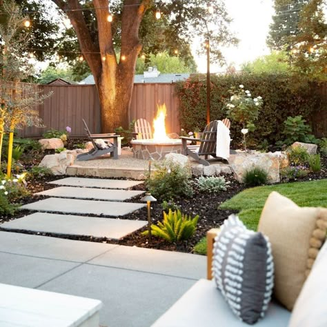 Check out our client's cozy backyard space with an outdoor fireplace and some patio string lights.Patio light string ideas | String lights outdoor | Outdoor string lighting ideas | Deck lighting ideas Fire Pit Ideas Backyard With Pavers, Elevated Outdoor Sitting Area, Outdoor Deck Patio Ideas, Paverstone Patio Ideas, Pool House Lighting, Pnw Backyard Ideas, Backyard For Families, Seating Area Under Tree, Backyard String Lights Ideas