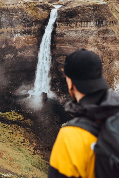 Man at the Haifoss waterfall, Iceland | premium image by rawpixel.com / Jack Anstey Trek Poses, Waterfall Picture Ideas Men, Waterfall Photoshoot Men, Stephen Aesthetic, Trekking Photography Poses, Poses Near Waterfall Men, Waterfall Photoshoot Ideas, Waterfall Aesthetic Couple, Waterfall Hiking Pictures