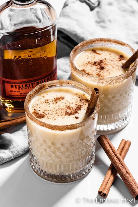 If you longed to dip into the holiday punch bowl that held the spiked eggnog, now's your chance to indulge in this sweet, warm, delicious bourbon eggnog. It's creamy and cozy and perfect for a cold winter's evening. #theendlessmeal #bourboneggnog #boozyeggnog #bourbon #eggnog #christmas #holiday #festive #cocktail #drink Christmas Cocktails Eggnog, Eggnog Bourbon Cocktail, Christmas Eggnog Cocktails, Christmas Cafe Drinks, Holiday Eggnog Cocktails, Christmas Breakfast Cocktails, Yule Cocktails, Christmas Cocktail Aesthetic, Christmas Whiskey Drinks