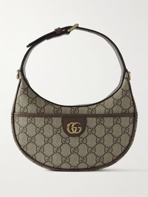 Gucci's accessories are nothing short of impeccable. This 'Ophidia' shoulder bag has been crafted in Italy from coated-canvas in a crescent shape, trimmed with a leather strap and centered with the iconic 'GG' hardware. Store your lip balm and compact as well as cardholder in the pocket. Gucci Saddle Bag, Gucci Circle Bag, Gucci Iconic Bag, Mini Shoulder Bag Outfit, Gucci Bag Ophidia, Brown Gucci Bag, Gucci Ophidia Bag, Shoulder Bag Outfit, Y2k Bags