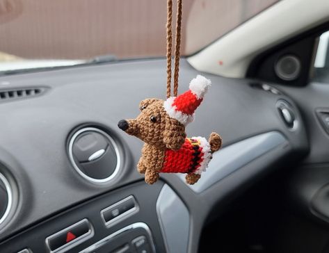 "This miniature dachshund in Santas costume is really cute hanger for your Christmas car decor. ✅MATERIALS: The toy is made of 55% cotton and 45% polyacrylic yarn and stuffed with hypoallergenic fiberfill. ✅ITEM DETAILS: The dachshund approx. 3.9 inches (10 cm) in height with hat. And 3.5 inches (9 cm) in length. ✅Other colors are possible. Just contact me. Find more cute Christmas car accessories for rear view mirror in my shop on section - \"Car accessories\" -  https://www.etsy.com/shop/Happy Crochet Car Accessories Christmas, Christmas Car Accessories, Christmas Car Hanger Crochet, Crochet Christmas Items, Christmas Car Decorations Interior, Christmas Crochet Car Hanger, Crochet Christmas Car Hanger, Crochet Car Ornament, Crochet Car Hanger