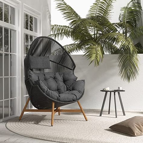 The beautiful lines of the egg chair deliver a style well suited to many style trends. The open weave wicker combined with olefin cushions will coordinate with any outdoor and indoor space, like garden, patio, pouch, balcony, living room and bedroom. This outdoor egg chair features durable steel frame, open-weave pattern wicker and an oversized thick cushion, it will cradle you within its egg-shaped body based on padded cushion and provide an extra-wide opening room overhead for tall people. Outside Egg Chair, Outdoor Egg Chair Patio, Comfy Outdoor Furniture, Egg Chair Outdoor, Acreage Landscaping, Black Outdoor Furniture, Patio Daybed, Gold Dining, House Items