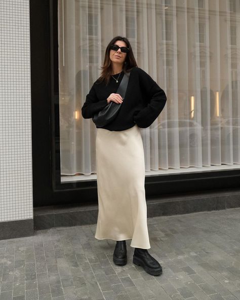 The Row Zip-Up Boots Are Back For Winter 2024 | Who What Wear Slip Skirt Outfit, Affordable Winter Outfits, Silk Skirt Outfit, Skirt Ootd, Ivory Skirt, Vegan Leather Skirt, Silk Midi Skirt, Winter Outfit Ideas, Winter Skirt Outfit