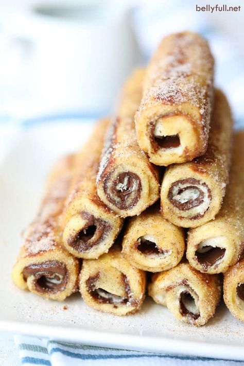 French Toast Roll-Ups stacked in a pyramid Ww Muffins, Toast Roll Ups, Ramadan Sweets, Pancake Roll, Vegetarian Nachos, French Toast Roll Ups, French Toast Rolls, Coffee Trailer, Breakfast Goodies