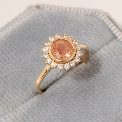 "Floral Oregon Sunstone Ring/Sunstone Diamond Halo Ring/Sunstone Engagement Ring for Her/14K Solid Gold/Natural Sunstone Jewelry/Handmade ★ ★ ★ ★  CUSTOM/DUTY-FREE SHIPPING WORLDWIDE, BUYERS DON'T HAVE TO PAY ANY CUSTOM FEES WHILE IMPORTING ★ ★ ★ ★  Details Made to order Material: 14k/18k gold Color Options: Yellow Gold, White Gold, Rose Gold ★ Center Stone Oregon Sunstone Round Size: 6 mm  Approx Weight (Ct): 1.03 ★ Accent Stones Diamond/Moissanite Round Size: 1.5 mm * 16 Nos.  Approx Weight (C Sunstone Wedding Ring, Sun Diamond Ring, Sun Engagement Ring, Sunburst Engagement Ring, Engagement Rings Boho, Sunflower Engagement Ring, Sunstone Engagement Ring, Boho Engagement Ring, Sunstone Ring