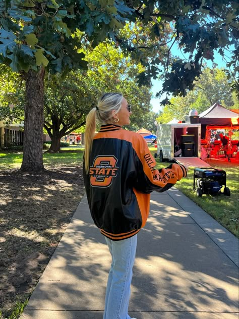 #gameday #outfit #gamedayoutfit #collegefootball #college #collegeoutfit #football #saturday #sportsjacket #bomberjackets #leatherjacket #cuteoutfit #cooloutfit #orangejacket #orangetop #orangeoutfit #footballgame #clothes #oklahomastate #osu #oklahoma #oklahomastateuniversity #outfitideas #sorority #fraternity #vintagecollege #vintagejacket #vintagestyle College Coach Outfit, Okstate Game Day Outfit, University Of Tennessee Outfits, Oklahoma State Outfits, Oklahoma State Gameday Outfits, Fall Gameday Outfit College, College Basketball Game Outfit, Osu Gameday Outfit, Oklahoma State Game Day Outfit