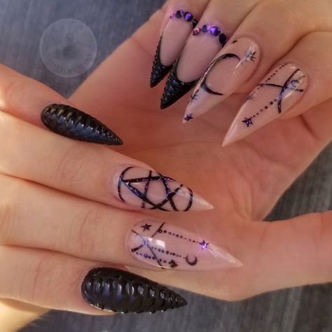 Witch halloween art stilettos star moon crescent purple black Pointy Witch Nails, Villain Nails Aesthetic, Ouji Board Nails, Witchy Stiletto Nails, Black And Dark Purple Nails, Witchy Nails Stiletto, Black Stilleto Nails Designs, Heavy Metal Nails, Halloween Stilleto Nails