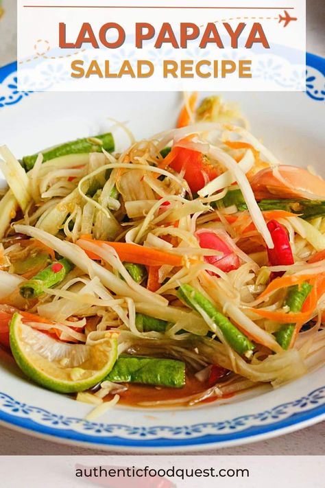 This easy, and vibrant Lao papaya salad recipe is a delicious and iconic Laotian dish. Bursts of crunchy, spicy, and tangy bliss come together with crisp shredded green papaya and tomatoes, green beans, and chilies. In just under 15 minutes, you can savor the harmonious balance of sweet, tangy, and spicy notes that make it an absolute delight! Papaya Salad Laos, Hot Slaw Recipe, Papaya Salad Recipe, Papaya Recipes, Green Papaya Salad, Spicy Salad, Laos Food, Green Papaya, Papaya Salad