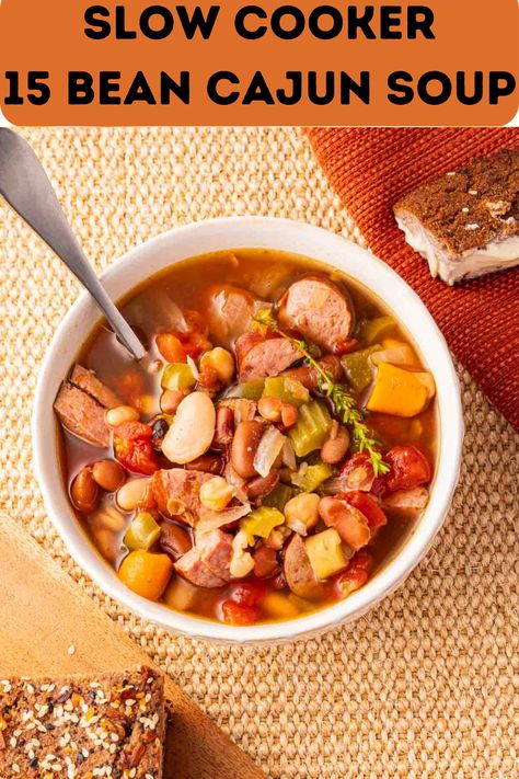 This Slow Cooker 15 Bean Cajun Soup is a super flavorful, hearty crockpot soup recipe that is filling and nutritious. It is easy on your budget and makes plenty of delicious leftovers. Cajun 15 Bean Soup Recipe, 15 Bean Soup, Breakfast Soup, Crockpot Soup Recipes, Bean Soup Recipes, Smoked Cooking, Soup Mixes, Crock Pot Soup, Smoked Sausage