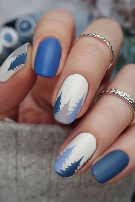 Here are 15 winter nail art ideas and designs you’ll definitely want to try out this year. Credit: evelinail_art Beach Winter Nails, Nails For Switzerland, New Gel Nail Designs 2023, Trendy Winter Nail Designs, Nails Tree Design, Nails With Tree Design, Alaska Vacation Nails, Earth Nail Art, Mountain Design Nails