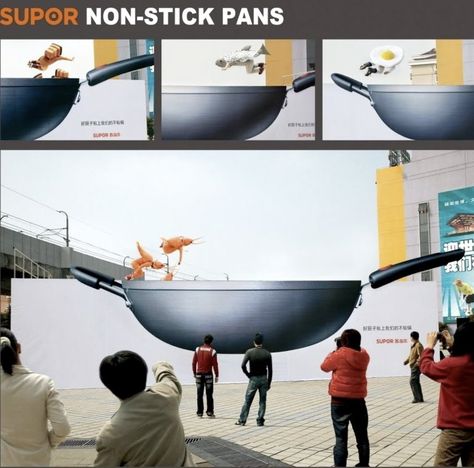 2009, via China, for Supor non-stick pans. The Shanghai office of Leo Burnett set up a giant wok outside shopping malls in the city. A ramp was placed behind it where skater boys and girls dressed as prawns, fish, pork, eggs, and carrots created the illusion of cooking non-stickiness. Ambient Advertising, Guerrilla Advertising, Leo Burnett, Clever Advertising, Cannes Lions, Publicidad Creativa, Street Marketing, Great Ads, Guerilla Marketing