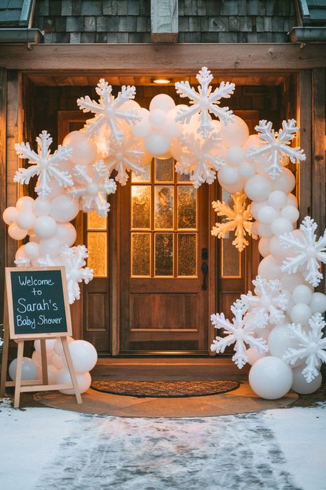 Beautiful winter baby shower entrance with a snowflake balloon arch and a welcome sign, creating a cozy and festive winter wonderland vibe. Winterland Party Decorations, Winter Themed Balloon Arch, Balloon Winter Wonderland, Winter Themed Christmas Decorations, Winter Wonderland Festival, Baby Shower Christmas Tree, Winter Wonderland Event Decor, Non Balloon Backdrop, Snowflake Party Ideas