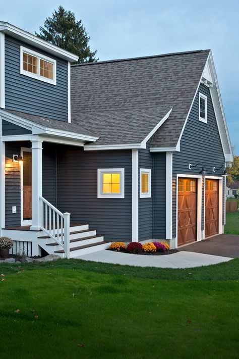 Blue House Black Door White Trim, Indigo Blue House Exterior, Black Roof Blue House, Slate Blue Siding Exterior, Blue House Wood Garage Door, Blue And Brown Exterior House Colors, Blue House Exterior With Wood, Blue Siding White Trim, Blue House Black Trim