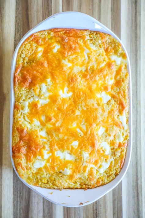 This Jiffy Corn Casserole is the BEST cheesy corn casserole recipe out there! It only has a few ingredients and takes minutes to make. The result is the most lusciously creamy, sweet corn filled casserole with savory cheese baked on top for the perfect corn pudding side dish. We love this casserole for thanksgiving, Christmas, Easter, and an easy side dish for grilling out. What makes this Jiffy Corn Casserole so special is the dollops of sour cream throughout the casserole adding flavor pops. Corn And Jiffy Mix Casserole, Corn Casserole With Frozen Corn, Cheesy Corn Casserole Jiffy, Sweet Corn Casserole Jiffy, Jiffy Corn Casserole 5 Ingredients, Corn Bake Casserole Jiffy, Corn Casserole Jiffy Easy, Cheesy Corn Casserole Recipe, Best Corn Casserole