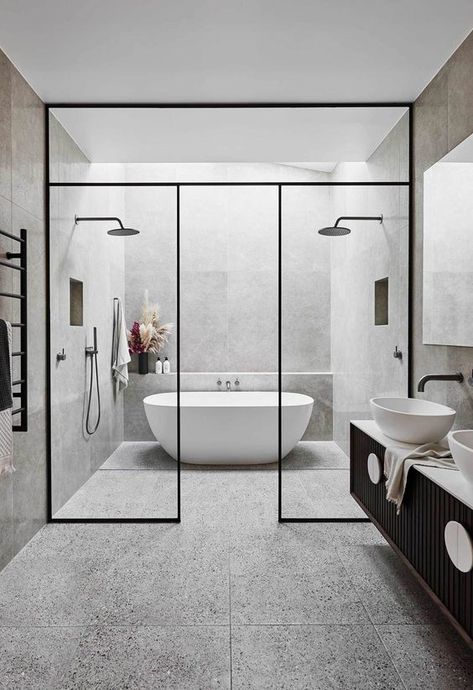 Beautiful, modern and stunning his and hers neutral double shower and oval bath with a black framed glass partition and black shower fixtures. #modernwetrooms #doubleshowerwetroom #neutralbathroomideas #wetrooms #modernbathroomideas #wetroombathroominspiration #wetroomideas Washroom Ideas, Drømme Bad, Washroom Tiles, Modular Bathroom, Interior Design Minimalist, Bathroom Trends, Bad Design, Dream Bathrooms, Bathroom Layout